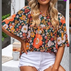 Black and orange floral bell sleeve crew neck top